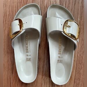 Birkenstock Women's Cream Slides with Gold Buckle